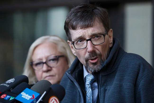 Bret McCann, flanked by his wife, Mary-Ann McCann, left, speaks to the media after giving a victim impact statement during the sentencing hearing for Travis Vader at the Edmonton Law Courts in Edmonton, Alta., on Monday, Dec. 12, 2016.