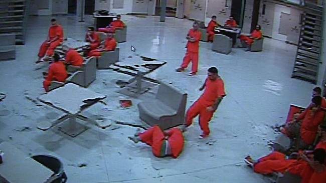 In a framegrab from a video from the Central Nova Scotia Correctional facility in Halifax inmate Dwayne Wright is kicked by inmate Charles Wallace.