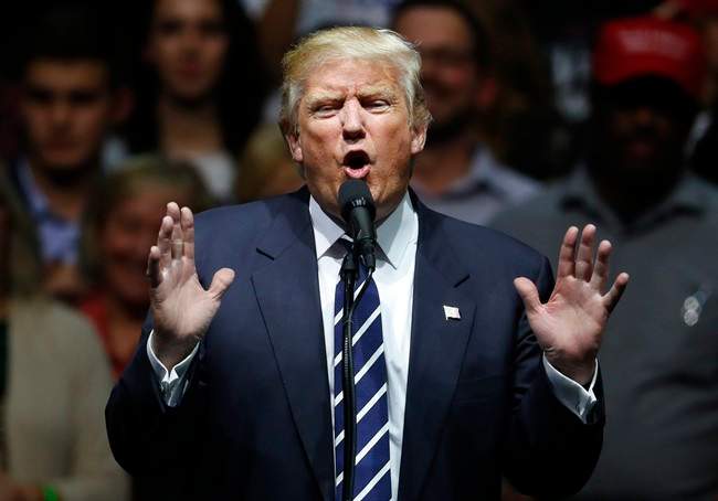 In this Dec. 9, 2016, photo, President-elect Donald Trump speaks to supporters during a rally, in Grand Rapids, Mich. In claiming that he scored ‚Äúa massive landslide victory‚Äù in last month‚Äôs presidential election, Trump turned history upside down. In fact, his winning margin in the Electoral College is on the other end of the historical spectrum, far closer to the narrowest win in history than to the widest. 