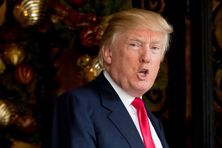 President-elect Donald Trump speaks to members of the media in Palm Beach, Fla., Wednesday, Dec. 21, 2016. 