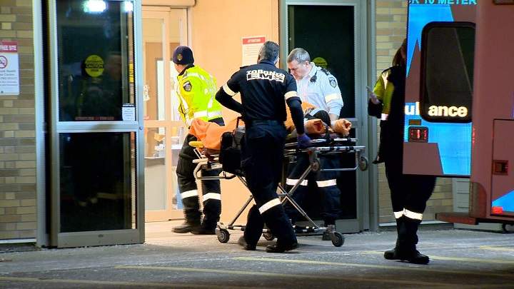 Toronto Paramedics rush a man with gun shot wounds to Sunnybrook Health Sciences Centre Wednesday evening.