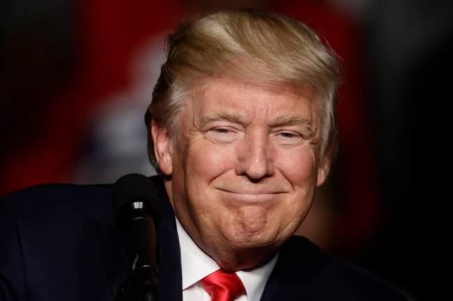 In this Thursday, Dec. 15, 2016 file photo, President-elect Donald Trump speaks during a rally at the Giant Center, in Hershey, Pa. 