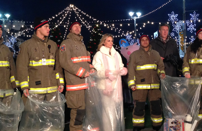 Susan Hay with firefighters at Toy Drive Live