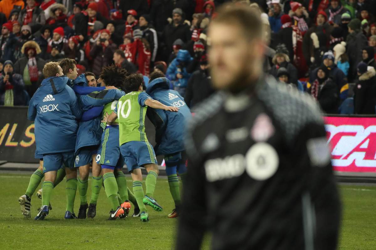 Seattle celebrates as Toronto FC goalkeeper Clint Irwin leaves the net Toronto FC  fans grieve as  Toronto FC loses to  Seattle Sounders in penalty kicks  in the MLS Cup Final  in Toronto. December 11, 2016. 