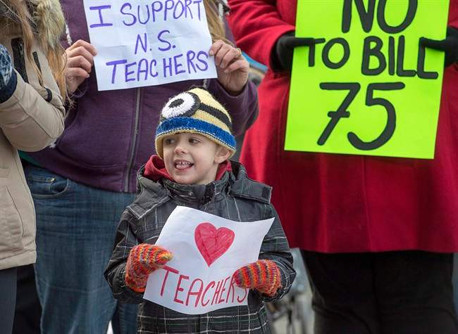 Students and parents protest outside the legislature in Halifax on Monday, Dec. 5, 2016. 