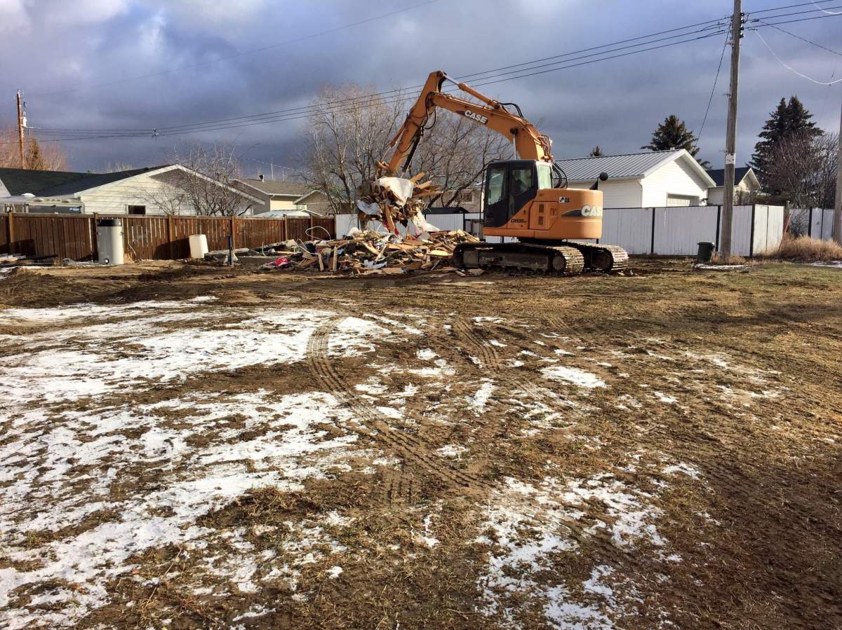 A new house in Carmangay is reduced to rubble after the town issued a court order to demolish the home.