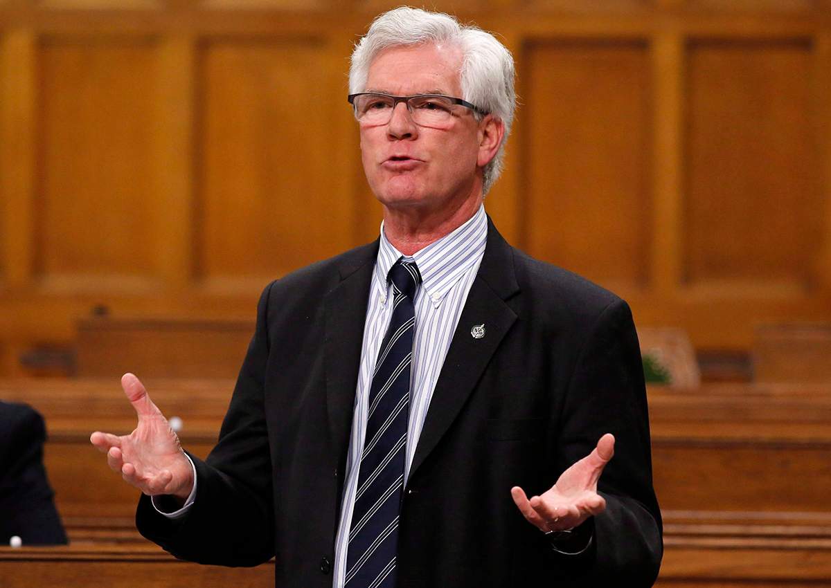 Natural Resources Minister Jim Carr stands in the House of Commons during question period, in Ottawa on Friday, December 9, 2016. 