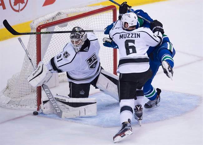 Los Angeles Kings defenceman Jake Muzzin (6) tries to clear Vancouver Canucks right wing Jack Skille (9) from in front of Los Angeles Kings goalie Peter Budaj (31) during third period NHL action in Vancouver, B.C., Wednesday, December 28, 2016. 