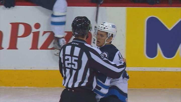 Manitoba Moose defenceman Brenden Kichton is taken to the penalty box on Saturday.