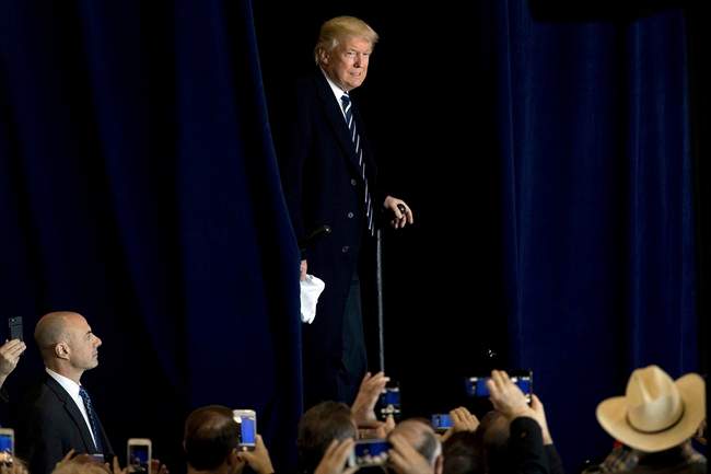 President-elect Donald Trump arrives for a rally in a DOW Chemical Hanger at Baton Rouge Metropolitan Airport, Friday, Dec. 9, 2016, in Baton Rouge, La. 