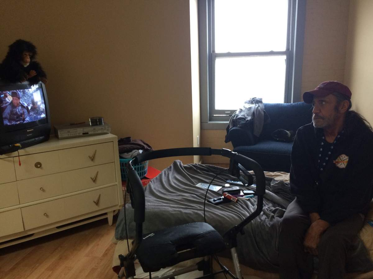 Larry Engbert has settled into his clean, safe apartment. A neighbour comes daily to help clean.