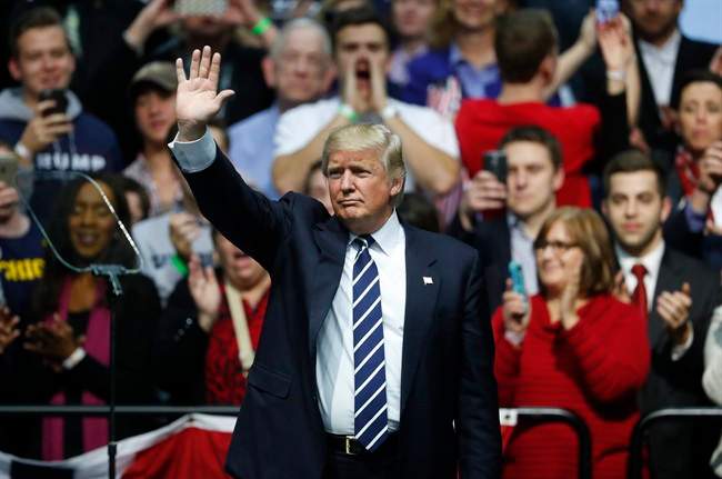 President-elect Donald Trump waves to supporters during a rally in Grand Rapids, Mich., Friday, Dec. 9, 2016.