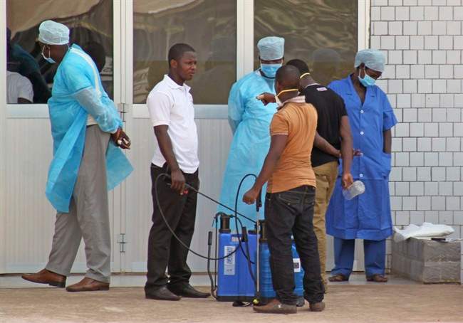 Medical personnel at the emergency entrance of a hospital wait to receive suspected Ebola virus patients in Conakry, Guinea in this March 29, 2014 file photo.