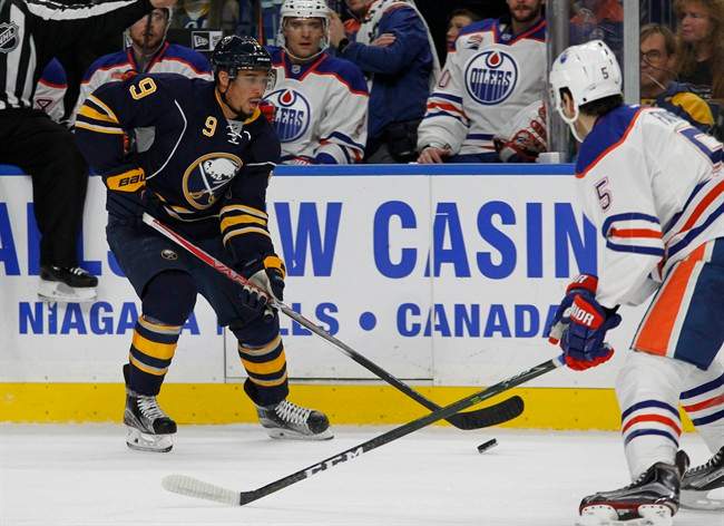 Buffalo Sabres forward Evander Kane (9) carries the puck into the zone during the first period of an NHL hockey game against the Edmonton Oilers, Tuesday, Dec. 6, 2016, in Buffalo, N.Y. 