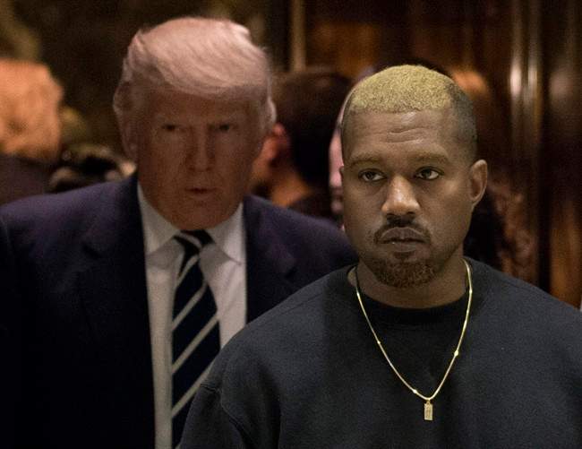Kanye West and President-elect Donald Trump arrive to the lobby of Trump Tower in New York, Tuesday, Dec. 13, 2016.
