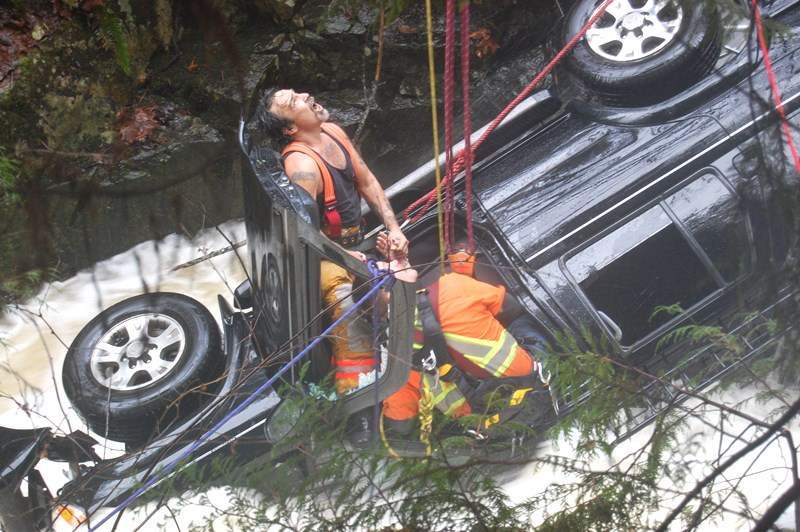 WATCH: Car plunges 40 feet off highway into roaring creek on Sunshine Coast - image