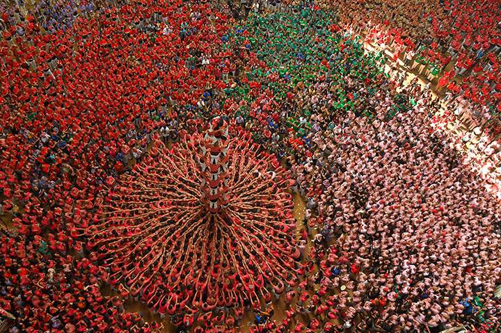 Members of a human tower team form a “castell” during the XXVI human towers competition in Tarragona, Spain on Oct. 2, 2016.