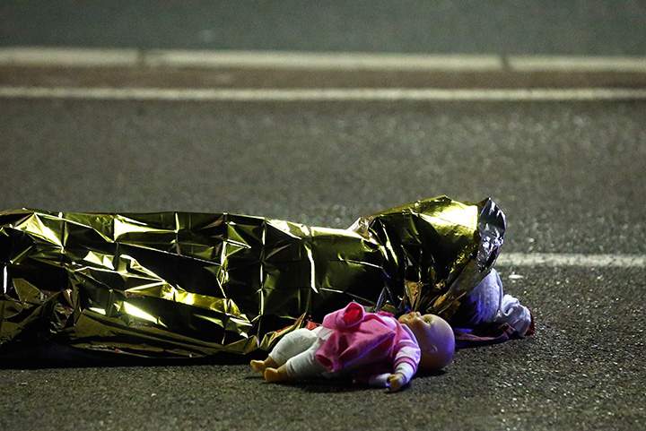 A body is seen on the ground after at least 30 people were killed in Nice, France.  A truck drove into a crowd that was celebrating Bastille Day on July 14, 2016.