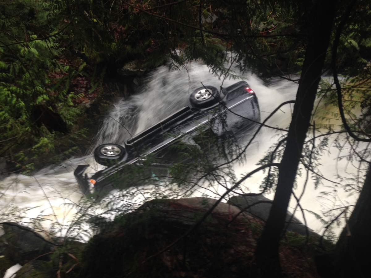 WATCH: Car plunges 40 feet off highway into roaring creek on Sunshine Coast - image