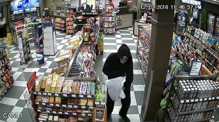 Saskatoon police have released a surveillance photo of two masked suspects during an armed robbery at a convenience store on Friday night.
