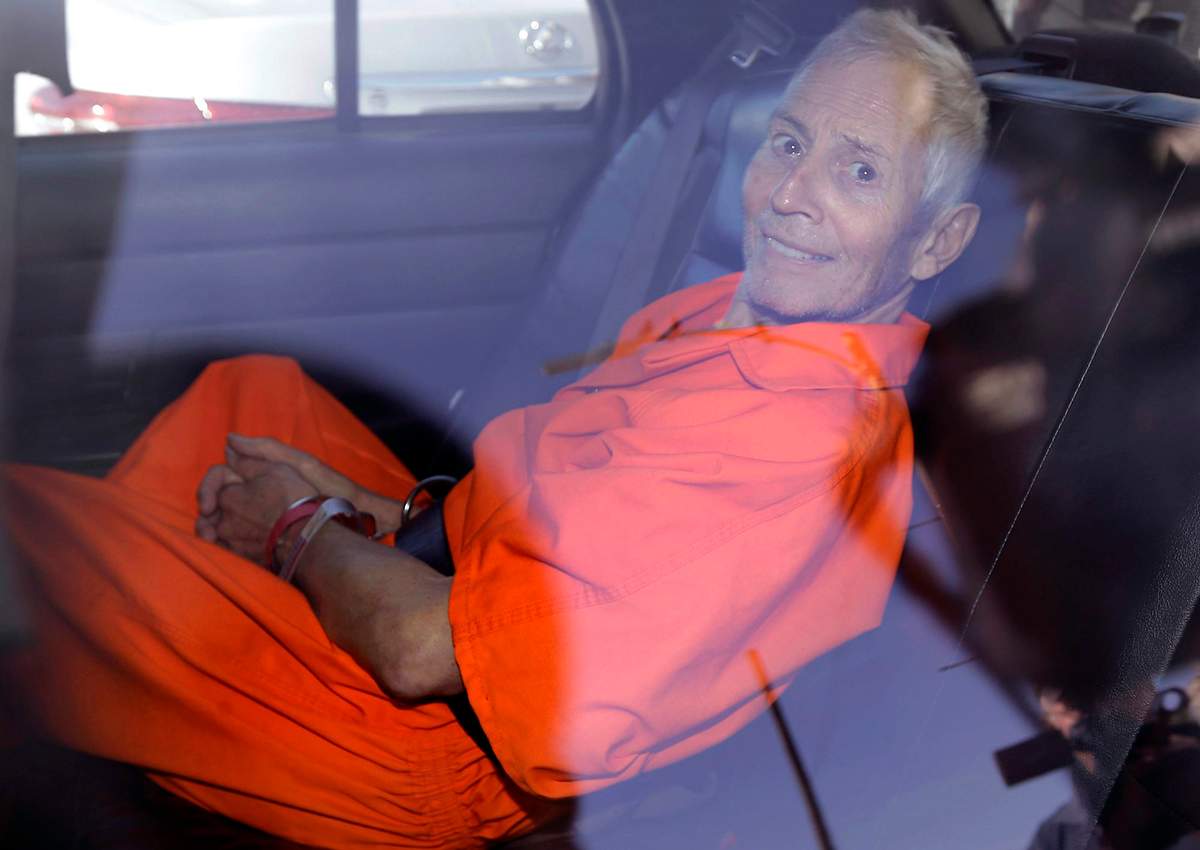 In March 17, 2015, file photo, New York real estate heir Robert Durst smiles as he is transported from Orleans Parish Criminal District Court to the Orleans Parish Prison after his arraignment on murder charges in New Orleans. 