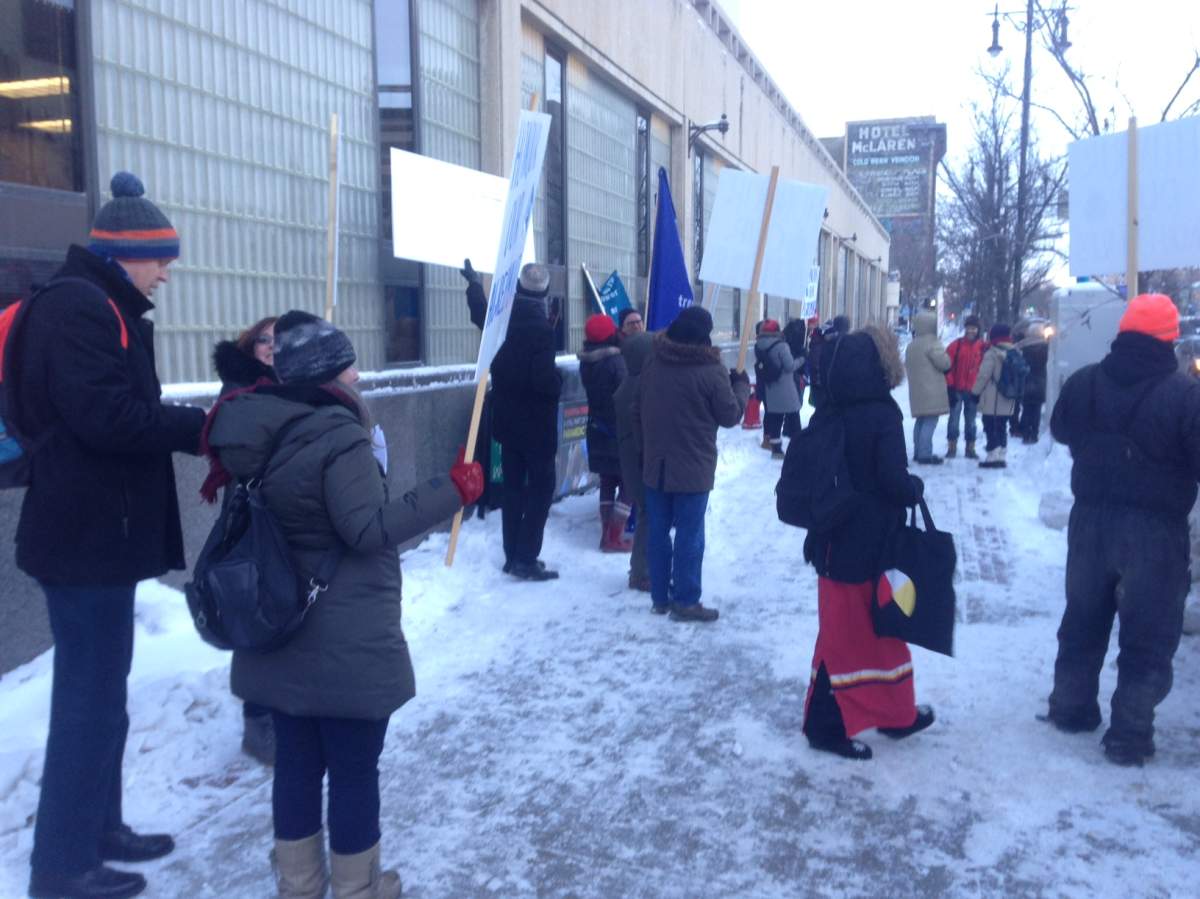 Demonstators outside of Winnipeg City Hall on Monday, hoping to bring awareness about the all-weather road for Shoal Lake 40 First Nation.