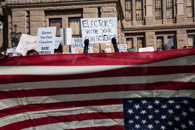 Demonstrators gather outside the Texas State Capitol in an attempt to influence the 38 Republican electors from across the state to not vote for Donald Trump when they cast their formal ballots for president of the United States in Austin, Texas, Monday, Dec. 19, 2016.