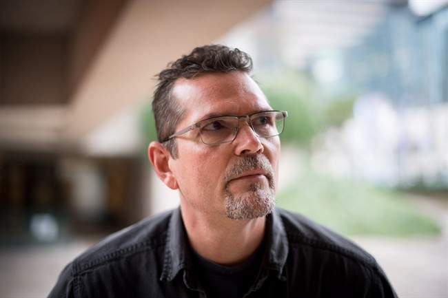 Former heroin user John Lenec, who has been clean for more than four years, poses for a photograph in Vancouver, B.C., on Wednesday November 23, 2016. Lenec remembers the song "Knockin' on Heaven's Door" going through his head moments after he slipped off a detox centre bed and began convulsing on the floor. It had been six hours since his last hit of heroin.
