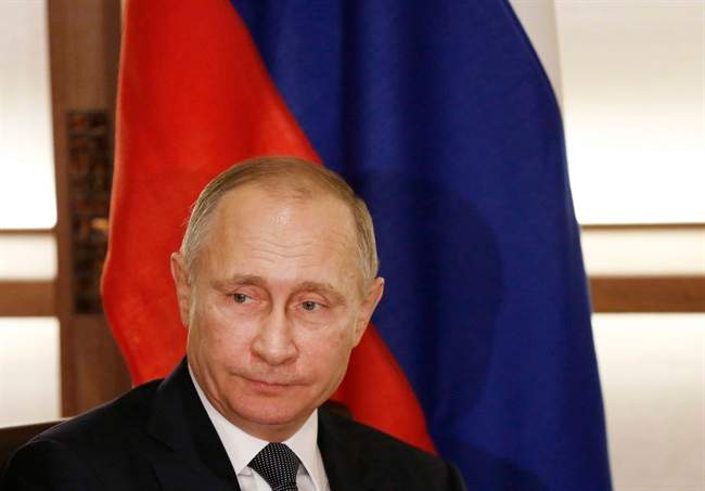 Russian President Vladimir Putin appears at a press conference. (Toru Hanai/Pool Photo via AP).