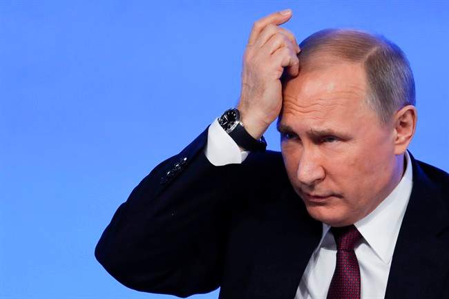 Russian President Vladimir Putin gestures during his annual news conference in Moscow, Russia, Friday, Dec. 23, 2016.