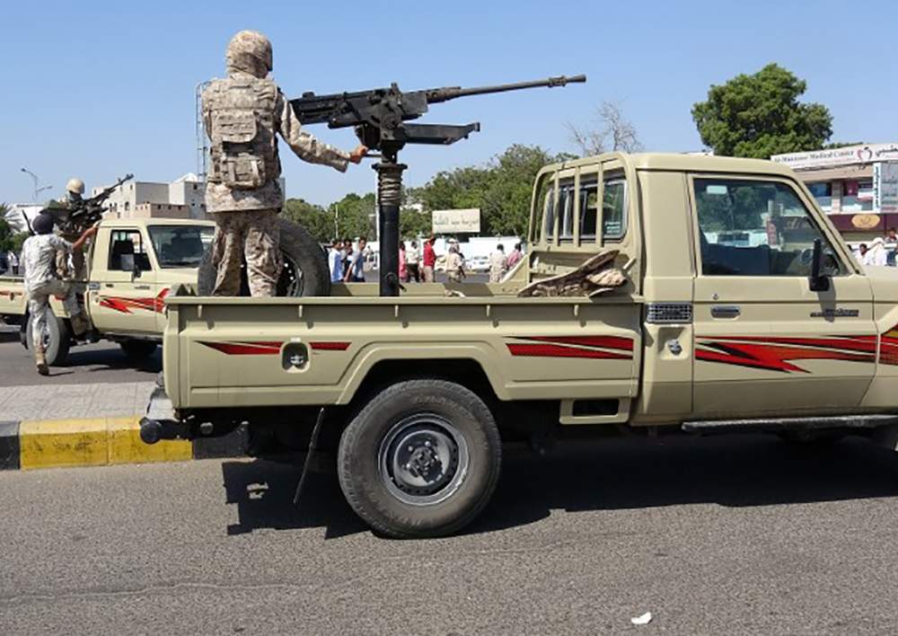 Army patrols are seen on a street near the site of a suicide bombing in the southern port city of Aden, Yemen December 18, 2016. 