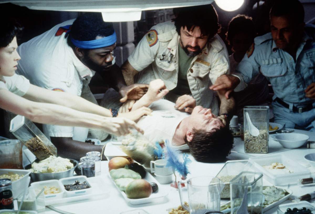 John Hurt is laid out on a table in a scene from Alien.