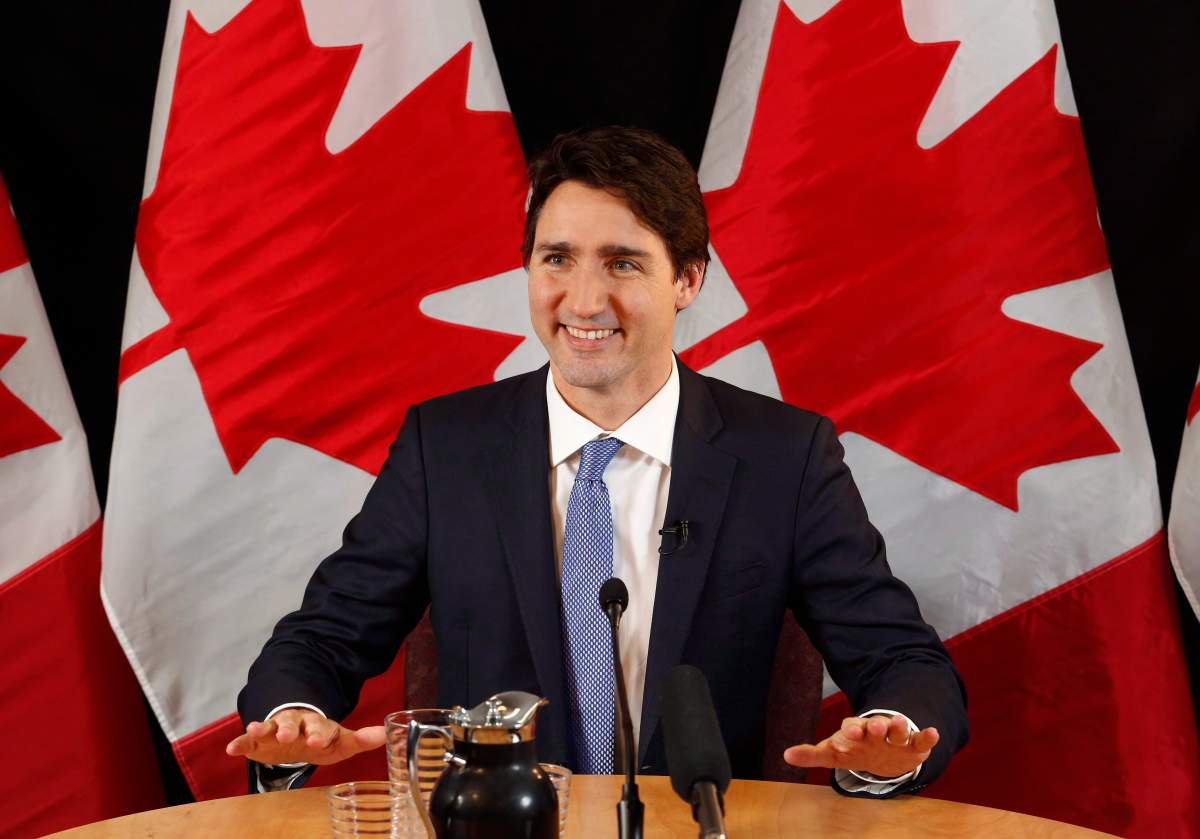 Prime Minister Justin Trudeau speaks with reporters during an interview with The Canadian Press in Ottawa on Wednesday, December 16, 2015. 