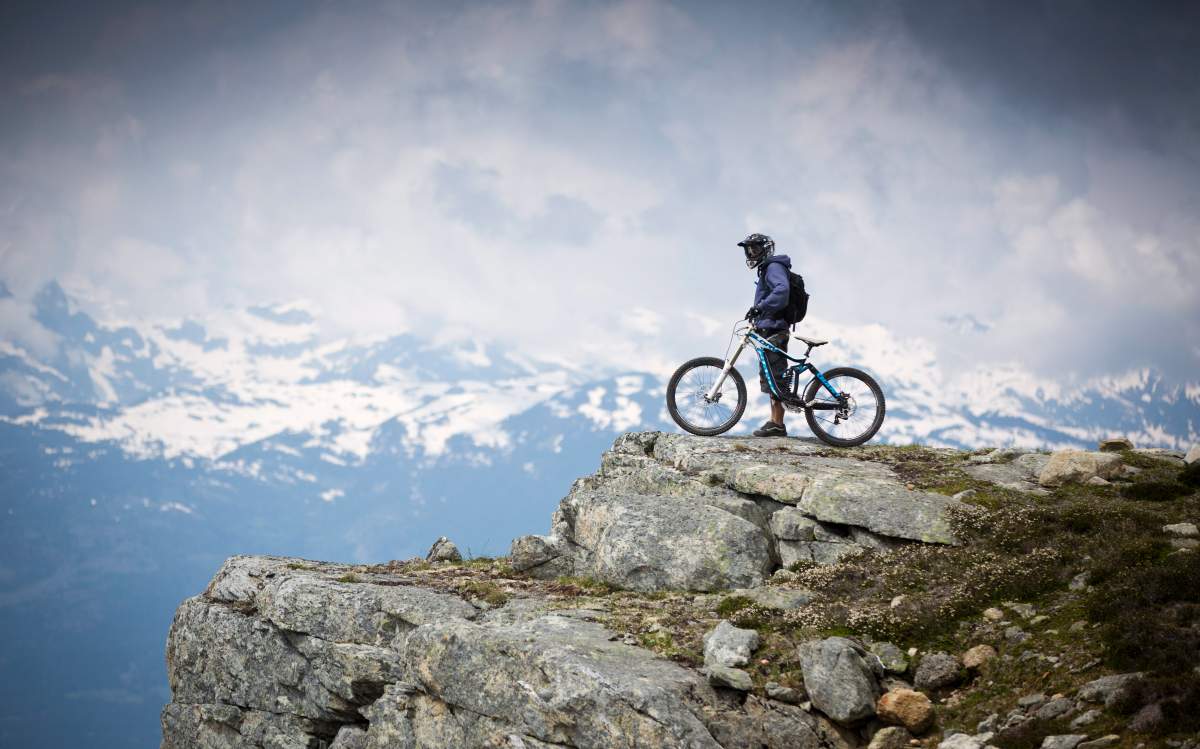 Peter Lonergan stops part way down the newly opened Top of the World Mountain alpine trail to take in the view July 28, 2012 at the peak of Whistler Mountain.