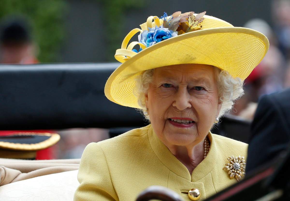 This is a Tuesday, June, 14, 2016 file photo of Britain's Queen Elizabeth II as she arrives by carriage on the first day of the Royal Ascot horse race meeting at Ascot, England. 