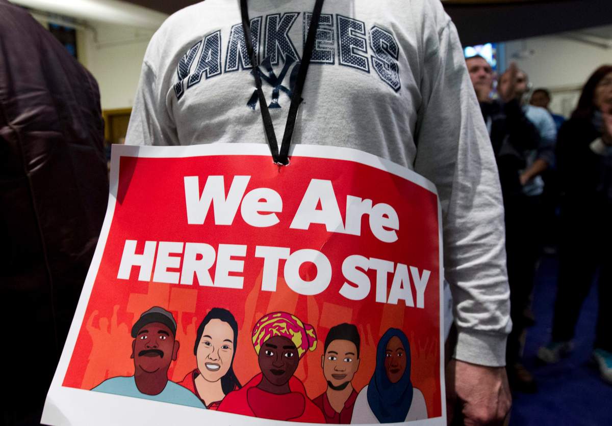 Immigrant rights advocates demonstrate against President-elect Donald Trump’s immigration policies, during a rally at Metropolitan AME Church in Washington, Saturday, Jan. 14, 2017.