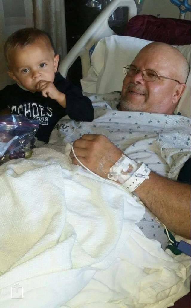 Robin Milne with his grandson in the hospital.