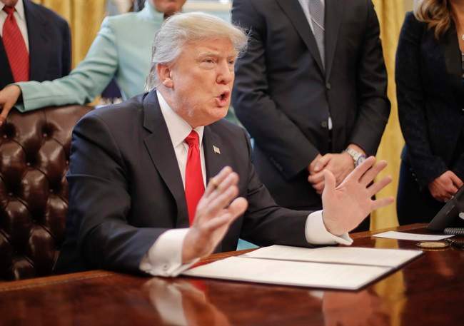 President Donald Trump speaks in the Oval Office of the White House in Washington, Monday, Jan. 30, 2017, before signing an executive order. 