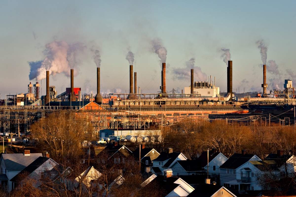 A Rio Tinto-Alcan plant is pictured near a residential area in the Arvida district of Saguenay, 225 kilometres northeast of Quebec City on Nov. 10, 2010.