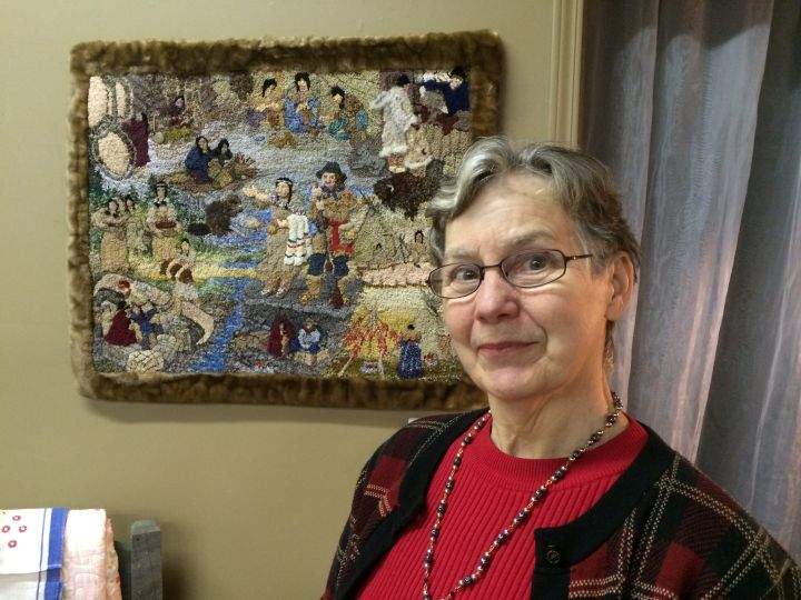 Calgary fibre artist Sharon Johnston with her piece depicting the fur trade.