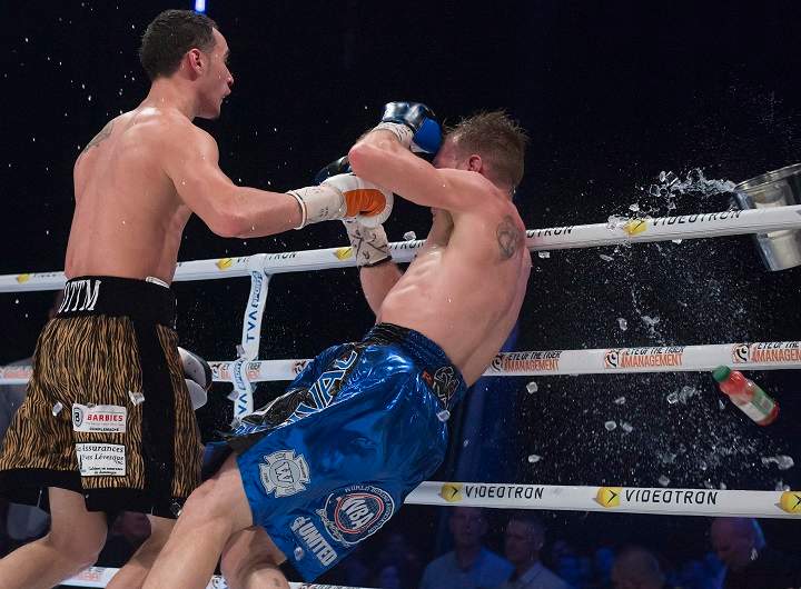 Brandon Cook is taken to the mat after being hit in the face with a steel ice bucket thrown from rink side after scoring a technical knockout against Steven Butler, left, who was on his way to congratulate him for winning their IBF/WBA light middleweight North American championship boxing match in Montreal on Saturday, January 28, 2017. THE CANADIAN PRESS/Peter McCabe