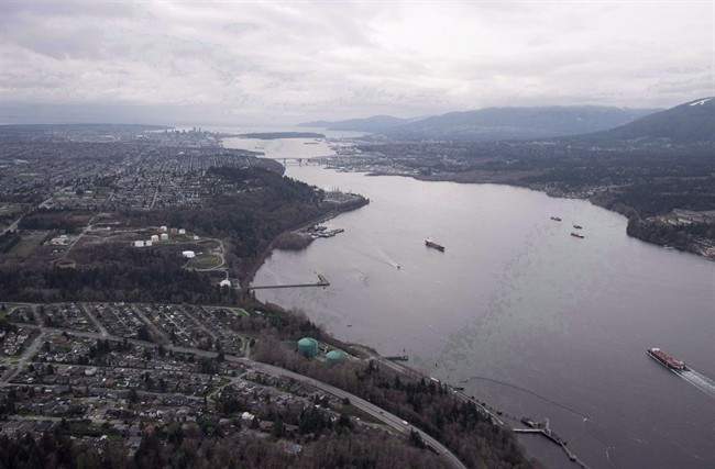 Kinder Morgan Trans Mountain Expansion Project’s Westridge loading dock, at bottom, with green tanks, is seen in Burnaby, B.C., on Friday, Nov. 25, 2016.