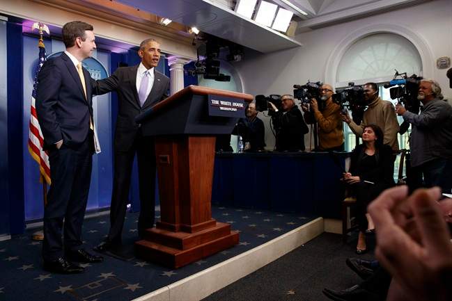 President Barack Obama stands with White House press secretary Josh Earnest during his last press briefing, Tuesday, Jan. 17, 2017, in the briefing room of the White House in Washington. (AP Photo/Evan Vucci).