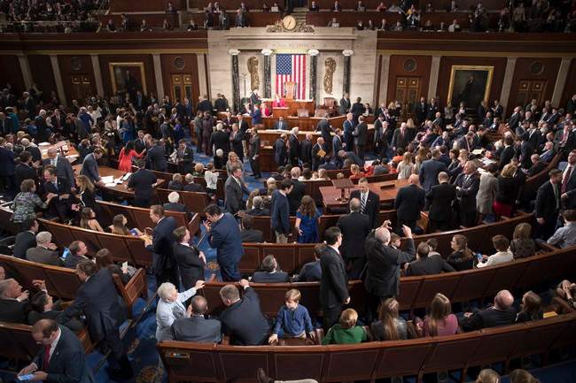Members of the House of Representatives, some joined by family, gather in the House chamber on Capitol Hill in Washington, Tuesday, Jan. 3, 2017, as the 115th Congress gets under way.