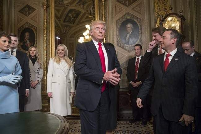 President Donald Trump leaves the President’s Room of the Senate on Capitol Hill in Washington, Friday, Jan. 20, 2017, after he formally signed his cabinet nominations into law.