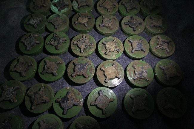 Anti personnel landmines which are believed to have been planted by the Syrian army on the border with Lebanon to prevent people from crossing in and out are seen at an agricultural field depot after being dug out by Syrian and Lebanese activists at an undisclosed location in the area of Akkar plain on the border with Syria north of Lebanon on February 29, 2012. 