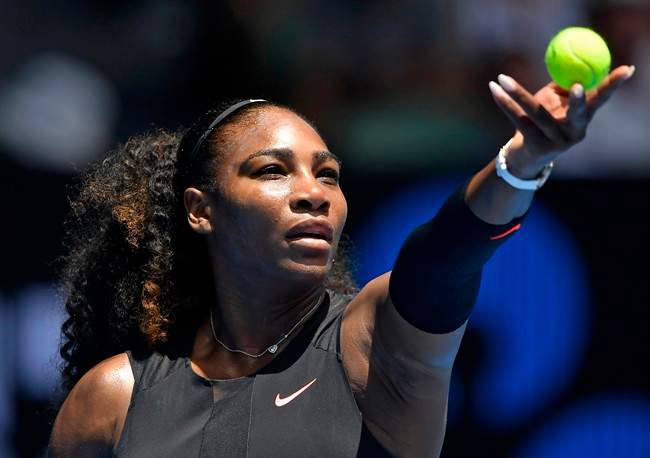 In this 2017 file photo, United States' Serena Williams prepares to serve to Switzerland's Belinda Bencic during their first round match at the Australian Open tennis championships in Melbourne. Tennis Canada announced the tennis star will not be playing in the Roger's Cup. Saturday, August 4, 2018.