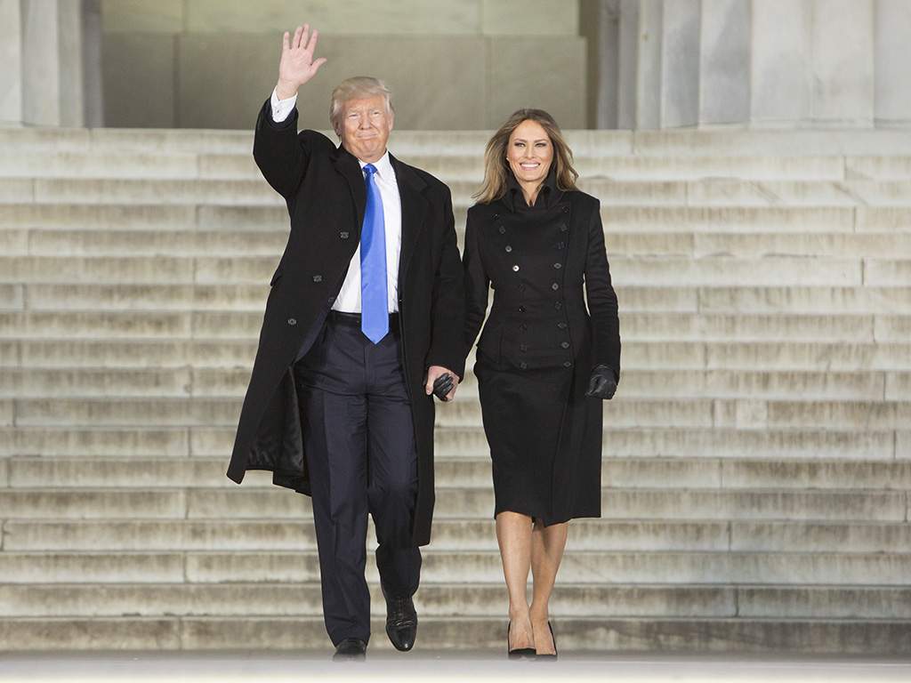 Melania Trump wears a military-inspired coat by New York designer Norisol Ferrari.