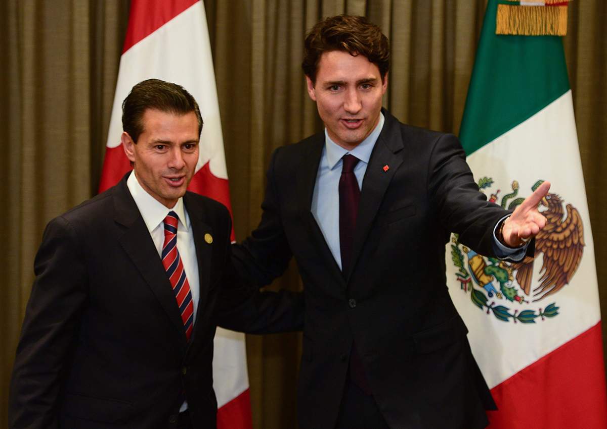 Prime Minister Justin Trudeau meets with Mexican President Enrique Pena Nieto during the APEC Summit in Lima, Peru on Saturday, Nov. 19, 2016.