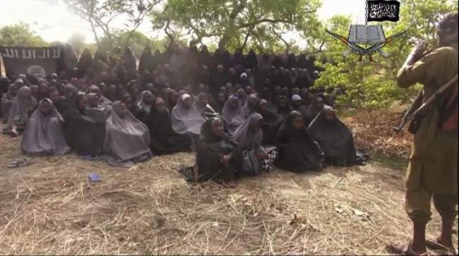 This Monday, May 12, 2014, file image taken from video by Nigeria's Boko Haram terrorist network shows the alleged missing girls abducted from the northeastern town of Chibok.